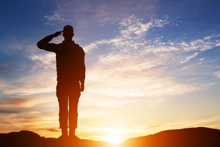Soldier salute. Silhouette on sunset sky. Army, military. Soldier salute. Silhouette on sunset sky. War, army, military, guard concept.